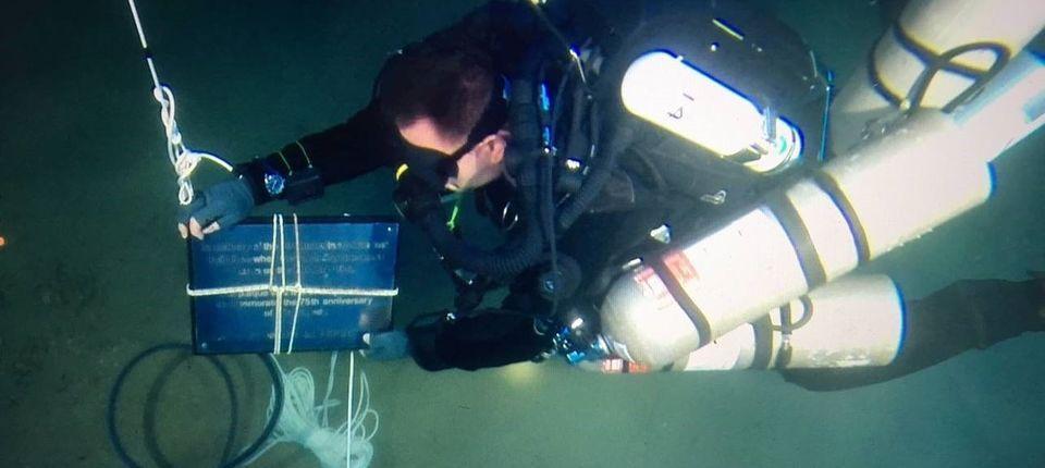 Dr Timmy Gambin with HMS Olympus plaque